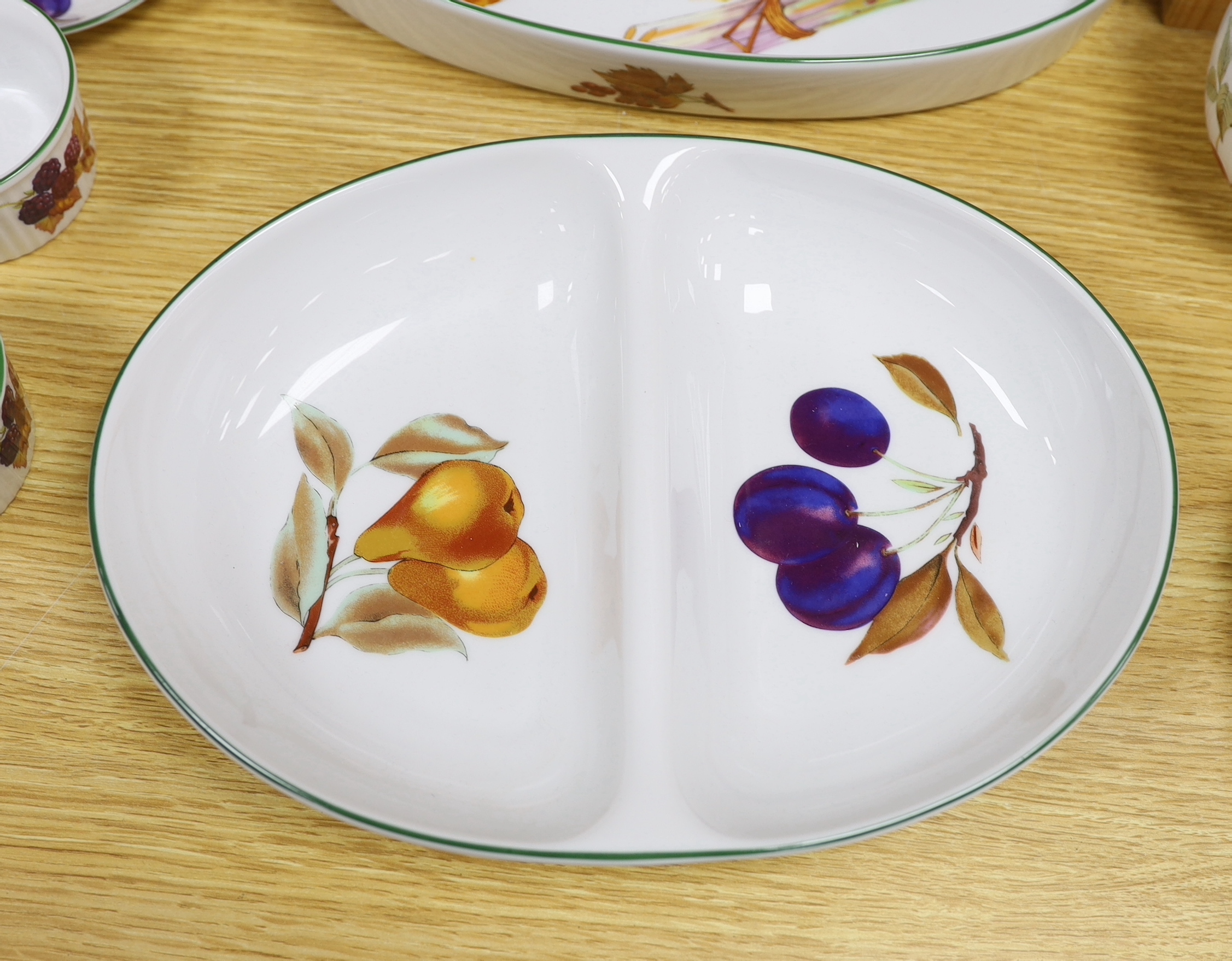 A large quantity of Royal Worcester Evesham Vale serving dishes and dinnerwares